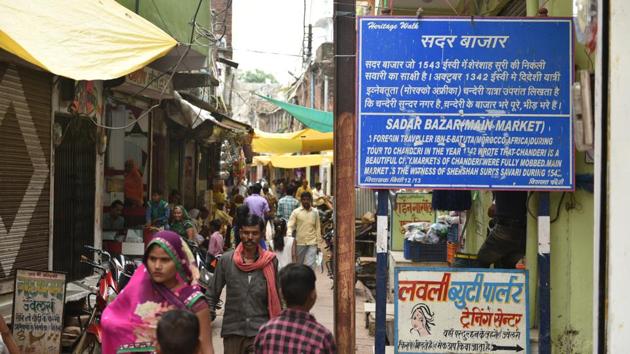 A board in the busy Sadar Bazar states that the great Moroccan traveller Ibn Battuta had in 1342 mentioned Chanderi as a beautiful town with busy markets that were always full of people. According to ASI, Chanderi was possibly one of the largest towns in Central India during the late 14th-15th century. Archaeologically, it is one of the richest sites of central India and has 11 protected sites. (Mujeeb Faruqui / HT Photo) A board in the busy Sadar Bazar states that the great Moroccan traveller Ibn Battuta had in 1342 mentioned Chanderi as a beautiful town with busy markets that were always full of people. According to ASI, Chanderi was possibly one of the largest towns in Central India during the late 14th-15th century. Archaeologically, it is one of the richest sites of central India and has 11 protected sites. (Mujeeb Faruqui / HT Photo)