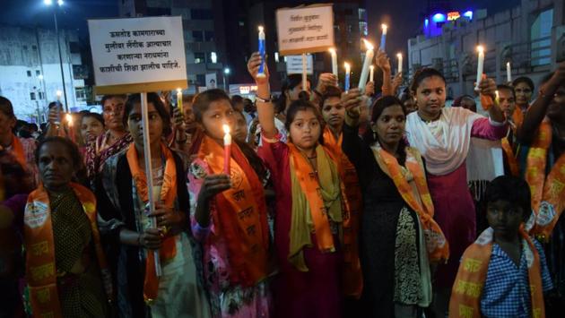 Members of Anyay atyachar kruti samiti, anti-torture action committee and other social organisations held a condolence meet to protest the death of a minor girl who was allegedly sexually assaulted near Sant Tukaram temple in the area under Hinjewadi police station jurisdiction on September 16, at Pimpri chowk on Thursday. (HT PHOTO)