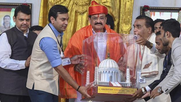 Vice-President M Venkaiah Naidu (centre) being presented with a memento by Vishwanath Karad (fourth from left), founder and director general, MAEER’s MIT and Rahul Karad (second from left, vice-president, MAEER’s MIT during the inauguration of World Peace Monument Dome at MIT Campus in Loni Kalbhor, Pune. Maharashtra CM Devendra Fadnavis ((left) was present at the event. (PTI)