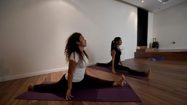 In a country where women have long been denied the right to exercise publicly, the students -- some of whom regularly attend yoga retreats in India -- said it had transformed their lives, also working as therapy, helping vent emotions and tackle a woefully common ailment -- depression. “It just opened me up like a water balloon,” said Yasmin Machri (L). “After my first class... I started breaking down and crying.” (Amer Hilabi / AFP)