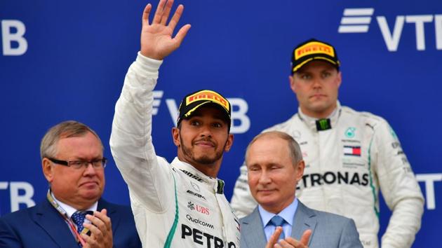 Lewis Hamilton celebrates with second placed Mercedes' Finnish driver Valtteri Bottas (right) and Russian President Vladimir Putin. (AFP) Lewis Hamilton celebrates with second placed Mercedes' Finnish driver Valtteri Bottas (right) and Russian President Vladimir Putin. (AFP)