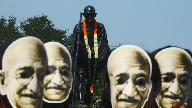 Students and volunteers wear masks of Mahatma Gandhi during a march to celebrate his 150th birth anniversary in Kolkata on October 2. (AFP) Students and volunteers wear masks of Mahatma Gandhi during a march to celebrate his 150th birth anniversary in Kolkata on October 2. (AFP)