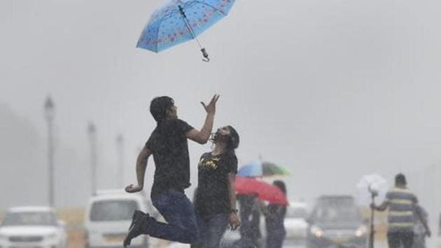 People cover themselves under umbrella during monsoon rainfall. (PTI Photo/Ravi Choudhary) People cover themselves under umbrella during monsoon rainfall. (PTI Photo/Ravi Choudhary)