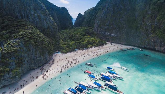 Maya Bay, ringed by cliffs on Ko Phi Phi Ley island, was made famous when it featured in the 2000 film starring Leonardo DiCaprio.(Unsplash)