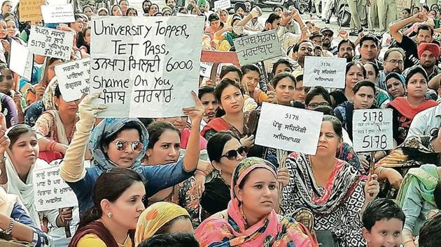 Contractual school teachers holding a protest at Hanuman Chowk in Bathinda on Tuesday.(HT Photo)