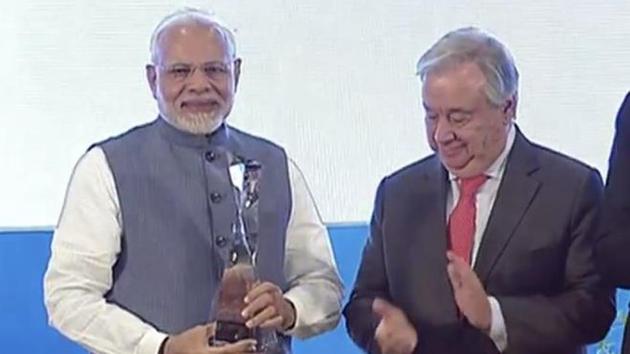 Prime Minister Narendra Modi receives the Champion of the Earth award from UN Secretary General Antonio Guterres in New Delhi.(ANI/Twitter)