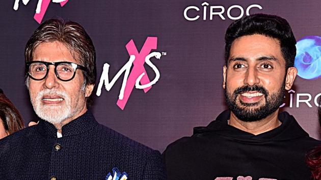 Indian Bollywood actors Amitabh Bachchan, Abhishek Bachchan during the store launch of the fashion label MXS in Mumbai.(AFP)