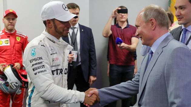 Russia President Vladimir Putin shakes hands with Lewis Hamilton. (AFP) Russia President Vladimir Putin shakes hands with Lewis Hamilton. (AFP)