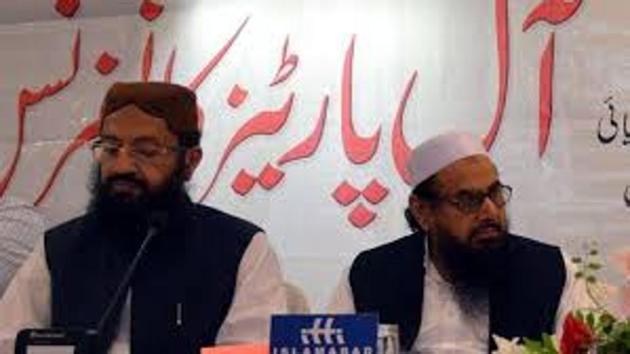 Hafiz Saeed (right) and Pakistan’s religious affairs minister Noor-Ul-Haq Qadri were seen together at an event in Islamabad. (Twitter/@NadeemAwan) Hafiz Saeed (right) and Pakistan’s religious affairs minister Noor-Ul-Haq Qadri were seen together at an event in Islamabad. (Twitter/@NadeemAwan)