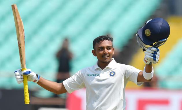 India's Prithvi Shaw celebrates after scoring a century (100 runs) during the first of the first Test cricket match between India and West Indies at the Saurashtra Cricket Association stadium in Rajkot (AFP) India's Prithvi Shaw celebrates after scoring a century (100 runs) during the first of the first Test cricket match between India and West Indies at the Saurashtra Cricket Association stadium in Rajkot (AFP)