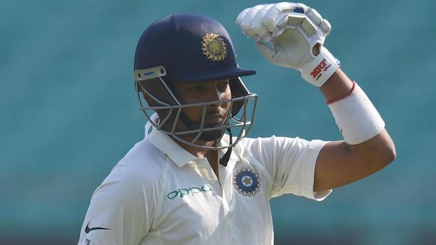 India's debutant batsman Prithvi Shaw signals to the dressing room. (AFP)