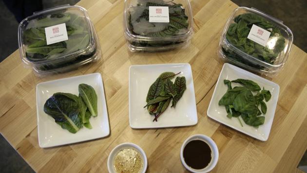 Packages of red romaine, red veined sorrel and basil are displayed at Iron Ox. It’s a tedious process to gently pick up each of the roughly 250 plants on each pallet and transfer them to their bigger pods, but the robot doesn’t seem to mind the work. Iron Ox still relies on people to clip its vegetables when they are ready for harvest, but Alexander says it is working on another robot that will eventually handle that. (Eric Risberg / AP) Packages of red romaine, red veined sorrel and basil are displayed at Iron Ox. It’s a tedious process to gently pick up each of the roughly 250 plants on each pallet and transfer them to their bigger pods, but the robot doesn’t seem to mind the work. Iron Ox still relies on people to clip its vegetables when they are ready for harvest, but Alexander says it is working on another robot that will eventually handle that. (Eric Risberg / AP)