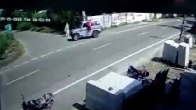 A CCTV grab of a woman falling off a speeding police vehicle in the Majitha area of Amritsar. (HT File) A CCTV grab of a woman falling off a speeding police vehicle in the Majitha area of Amritsar. (HT File)