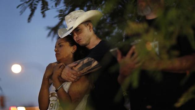 People attend a ceremony to dedicate a memorial garden for victims, on the anniversary of the mass shooting a year earlier, in Las Vegas, Nevada. (John Locher / AP) People attend a ceremony to dedicate a memorial garden for victims, on the anniversary of the mass shooting a year earlier, in Las Vegas, Nevada. (John Locher / AP)
