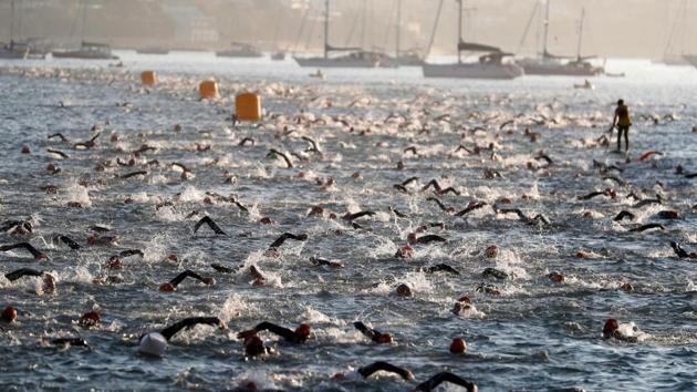 Athletes participate in the Ironman 70.3 race in Cascais, Portugal. (Rafael Marchante / REUTERS) Athletes participate in the Ironman 70.3 race in Cascais, Portugal. (Rafael Marchante / REUTERS)
