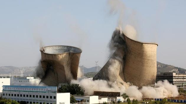 Cooling towers collapse during a controlled demolition at Huadian Shiliquan power plant in Zaozhuang, Shandong province, China. (REUTERS) Cooling towers collapse during a controlled demolition at Huadian Shiliquan power plant in Zaozhuang, Shandong province, China. (REUTERS)