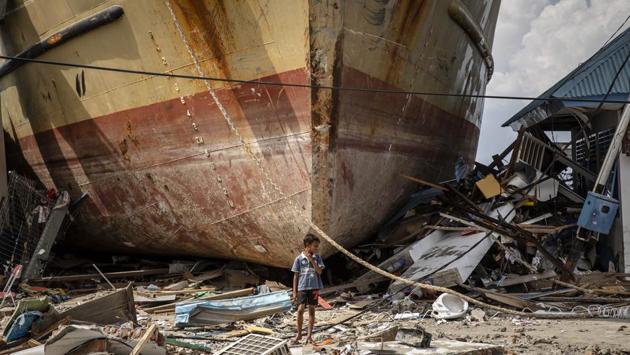 A boy stands in front of a stranded ship after a deadly tsunami struck the area in Donggala, Central Sulawesi, Indonesia. (Ulet Ifansasti / Getty Images) A boy stands in front of a stranded ship after a deadly tsunami struck the area in Donggala, Central Sulawesi, Indonesia. (Ulet Ifansasti / Getty Images)