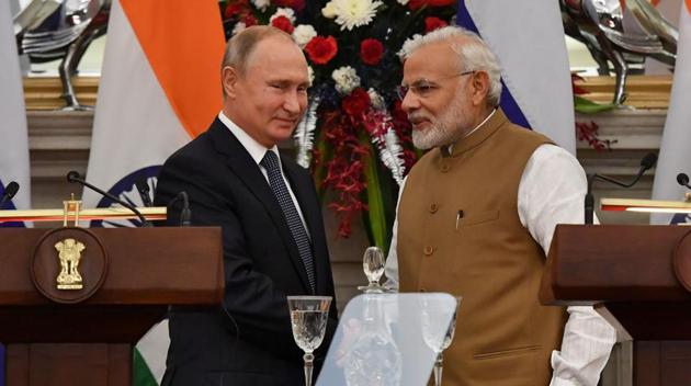 Russian president Vladimir Putin and Prime Minister Narendra Modi shake hands after delivering a joint statement following their talks at Hyderabad House in New Delhi on October 5, 2018. (AFP Photo) Russian president Vladimir Putin and Prime Minister Narendra Modi shake hands after delivering a joint statement following their talks at Hyderabad House in New Delhi on October 5, 2018. (AFP Photo)