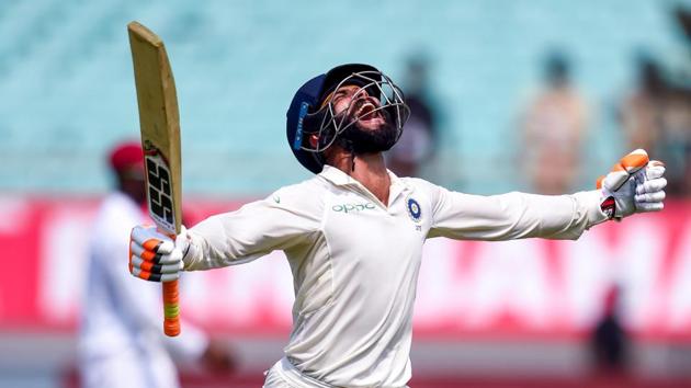 Rajkot: Indian batsman Ravindra Jadeja celebrates his century during the first test cricket match played between India and West Indies in Rajkot. (PTI) Rajkot: Indian batsman Ravindra Jadeja celebrates his century during the first test cricket match played between India and West Indies in Rajkot. (PTI)