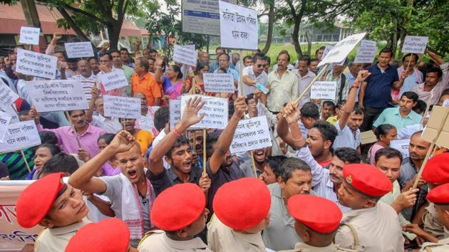Kalita Janagosthi Sanmilan activists raise slogans during a protest demanding Schedule Tribe (ST) status at Six Mile, in Guwahati, Assam. (PTI)