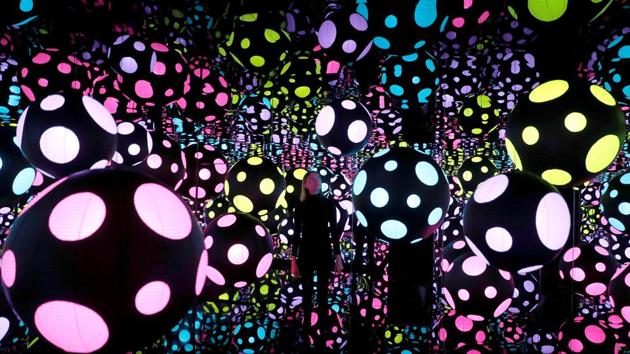 A Victoria Miro gallery staff member poses for a picture next to Yayoi Kusama’s installation, Infinity Mirrored Room-My Heart Is Dancing Into The Universe, in London, England. (Peter Nicholls / REUTERS) A Victoria Miro gallery staff member poses for a picture next to Yayoi Kusama’s installation, Infinity Mirrored Room-My Heart Is Dancing Into The Universe, in London, England. (Peter Nicholls / REUTERS)