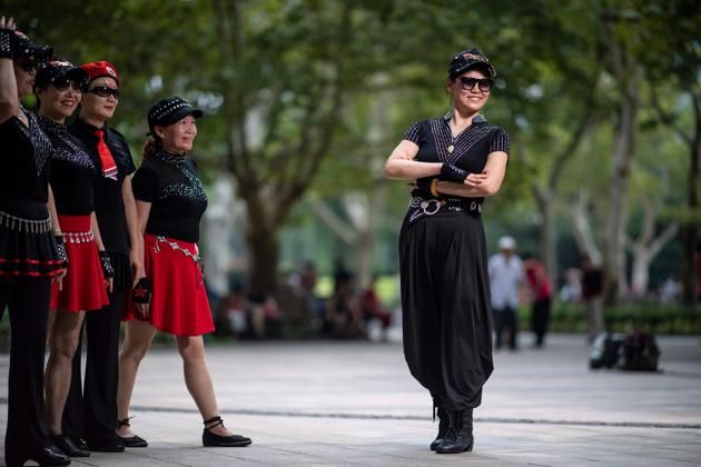 Every day, an estimated more than 100 million people -- dubbed “dancing aunties” as they are primarily older women -- take over squares and parks to tango, waltz, and grind out everything from flamenco to Chinese traditional dance. Complaints over speakers blaring late at night have ensued, and even physical brawls pitting aunties against others vying for park turf. (Johannes Eisele / AFP) Every day, an estimated more than 100 million people -- dubbed “dancing aunties” as they are primarily older women -- take over squares and parks to tango, waltz, and grind out everything from flamenco to Chinese traditional dance. Complaints over speakers blaring late at night have ensued, and even physical brawls pitting aunties against others vying for park turf. (Johannes Eisele / AFP)
