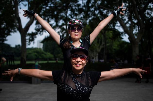 Zhang “was sitting at home, doing nothing” after retiring five years ago from her job and treating diabetes, high blood pressure and cholesterol. “Since I started dancing, my (health) indicators are now normal. I no longer need medication,” she said as her neighbourhood dance group twirled. “I also look younger,” said Zhang, who has jitterbugged away 11kg of bodyweight. (Johannes Eisele / AFP) Zhang “was sitting at home, doing nothing” after retiring five years ago from her job and treating diabetes, high blood pressure and cholesterol. “Since I started dancing, my (health) indicators are now normal. I no longer need medication,” she said as her neighbourhood dance group twirled. “I also look younger,” said Zhang, who has jitterbugged away 11kg of bodyweight. (Johannes Eisele / AFP)
