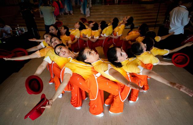 A group of square dancers practices in the lobby of a local theatre. Mass public dancing took root after the 1949 Communist takeover as the government organised communal activities to foster unity and loyalty to the party. But it has really taken off lately as China finds more leisure time, and nearly every neighbourhood park or square today is enlivened by dancers availing the free exercise. (Johannes Eisele / AFP) A group of square dancers practices in the lobby of a local theatre. Mass public dancing took root after the 1949 Communist takeover as the government organised communal activities to foster unity and loyalty to the party. But it has really taken off lately as China finds more leisure time, and nearly every neighbourhood park or square today is enlivened by dancers availing the free exercise. (Johannes Eisele / AFP)