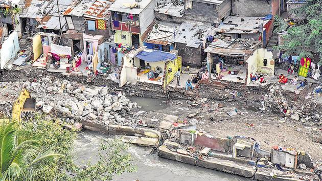 Broken walls and shattered homes is all that remains for the slum dwellers near Dandekar bridge.(HT PHOTO Sanket Wankhade) Broken walls and shattered homes is all that remains for the slum dwellers near Dandekar bridge.(HT PHOTO Sanket Wankhade)