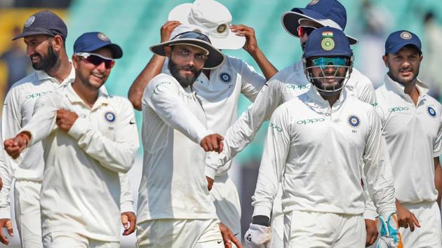 Rajkot: Indian players celebrate the wicket of West Indies batsman Devendra Bishoo during their first test cricket match (PTI) Rajkot: Indian players celebrate the wicket of West Indies batsman Devendra Bishoo during their first test cricket match (PTI)