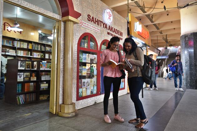 Bibliophiles indulged in reading joy at Kashmere Gate metro station's book store in New Delhi.(Raj K Raj)