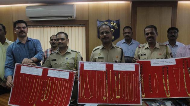 Thane police display gold chains and mangalsutras they seized from the accused, on Friday. (Praful Gangurde/HT) Thane police display gold chains and mangalsutras they seized from the accused, on Friday. (Praful Gangurde/HT)