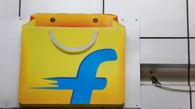 A Common myna sits next to the logo of India's e-commerce firm Flipkart installed on the company's office in Bengaluru. (REUTERS) A Common myna sits next to the logo of India's e-commerce firm Flipkart installed on the company's office in Bengaluru. (REUTERS)
