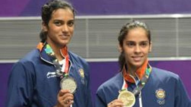 Women's singles badminton silver medalist Pusarla V Sindhu and bronze medalist Saina Nehwal pose for a photograph after the medal ceremony of the event at the 18th Asian Games in Jakarta, Indonesia on Tuesday, Aug 28, 2018.(PTI)