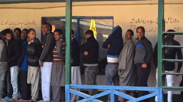 Kashmiri men in queue to cast their vote in Hamdaniya colony area of Srinagar on Monday, 8 October 2018. (Waseem Andrabi/ Hindustan Times) Kashmiri men in queue to cast their vote in Hamdaniya colony area of Srinagar on Monday, 8 October 2018. (Waseem Andrabi/ Hindustan Times)