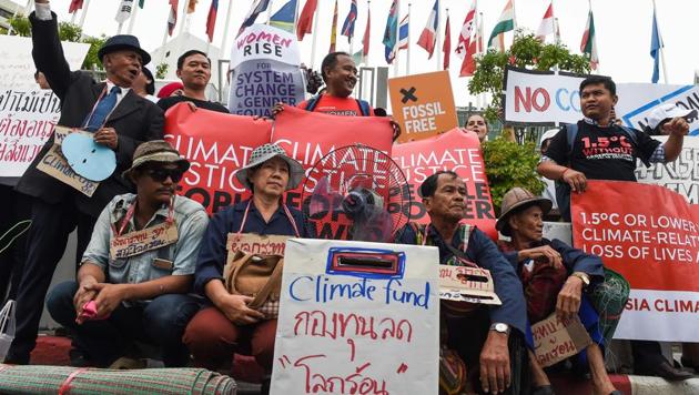 Environmental activists and supporters participate in a demonstration in front of the United Nations building, where experts from across the planet locked in key talks aimed at breathing life into the Paris Agreement on climate change, in Bangkok on September 8, 2018 (AFP) Environmental activists and supporters participate in a demonstration in front of the United Nations building, where experts from across the planet locked in key talks aimed at breathing life into the Paris Agreement on climate change, in Bangkok on September 8, 2018 (AFP)
