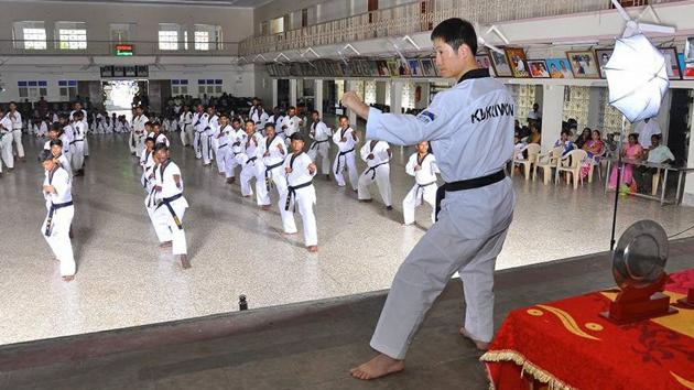 Korean grand master Jeonghee Lee is seen in this file photo conducting taekwondo class. Lee is one of the key organisers of the national taekwondo meet to take place in Pune.(HT PHOTO)