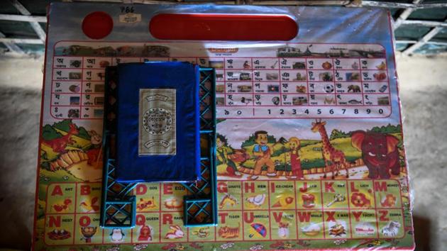 A Quran is kept on a table in Kutupalong camp. Madrassas also play an essential role in the survival of the Rohingya language. Some are attached to prominent mosques and large enough for 400 students. Others, like Saleema’s, cannot fit many more than a dozen. Classes are taught not just in the Rohingya language but also in Bengali, Arabic, Urdu and English. (Chandan Khanna / AFP) A Quran is kept on a table in Kutupalong camp. Madrassas also play an essential role in the survival of the Rohingya language. Some are attached to prominent mosques and large enough for 400 students. Others, like Saleema’s, cannot fit many more than a dozen. Classes are taught not just in the Rohingya language but also in Bengali, Arabic, Urdu and English. (Chandan Khanna / AFP)