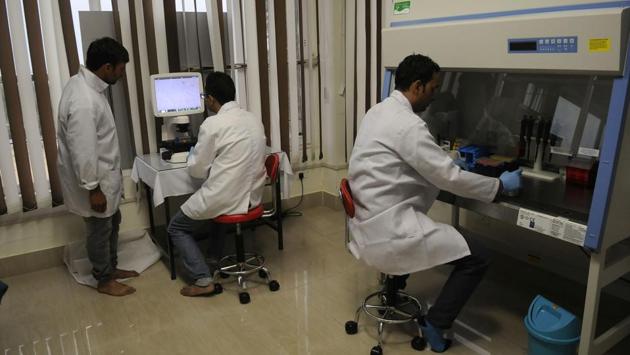 Scientists at work in a lab at the SKUAST fish hospital. Nasir Ahmad, a 45-year-old fish farmer from Bandipora district, said the hospital was helping reduce losses. He rushed to the hospital in August after his trout fish contracted a bacterial infection.“...They prescribed me medicine and I managed to save some 500 of my frys,” Ahmad said. (Waseem Andrabi / HT Photo )