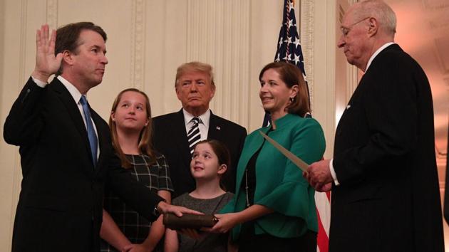 Brett Kavanaugh (L) is sworn in as associate justice of the US Supreme Court as President Donald Trump and the Kavanaugh family looks on. (AFP) Brett Kavanaugh (L) is sworn in as associate justice of the US Supreme Court as President Donald Trump and the Kavanaugh family looks on. (AFP)