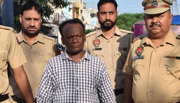 Accused Gorak Nath of Balongi in police custody.(HT Photo)