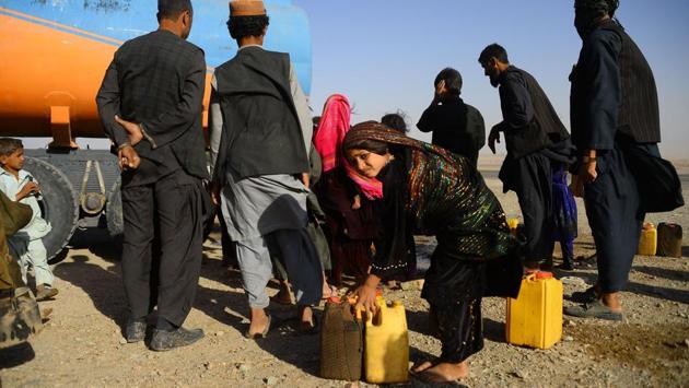 Photos: Afghan farmers fleeing drought face more hardship in camps ...