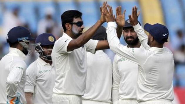 Indian cricketer Ravichandran Ashwin celebrates with teammates after dismissing West Indies' Shai Hope during the second day of the first Test match between India and West Indies in Rajkot, India, Friday, Oct. 5, 2018. (AP) Indian cricketer Ravichandran Ashwin celebrates with teammates after dismissing West Indies' Shai Hope during the second day of the first Test match between India and West Indies in Rajkot, India, Friday, Oct. 5, 2018. (AP)