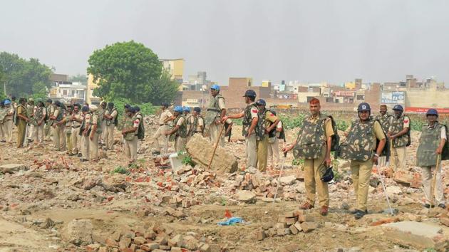 Heavy police force deployed outside Hisar Jail as self-styled godman Rampal is taken to court. On Thursday, a local court in Haryana’s Hisar found Rampal guilty in two murder cases. Deputy commissioner Ashok Kumar said that the quantum of punishment for each of the murder cases will be pronounced on October 16 and 17. (PTI)