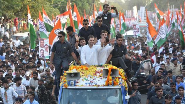 Congress president Rahul Gandhi waves to his supporters during a roadshow, at Jabalpur, in Madhya Pradesh on October 6.(HT File Photo/Mujeeb Faruqui)