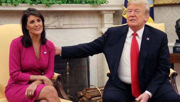 US President Donald Trump reaches out to outgoing US Ambassador to the United Nations Nikki Haley as they meet in the Oval Office of the White House after the president accepted Haley's resignation in Washington, October 9, 2018. (REUTERS) US President Donald Trump reaches out to outgoing US Ambassador to the United Nations Nikki Haley as they meet in the Oval Office of the White House after the president accepted Haley's resignation in Washington, October 9, 2018. (REUTERS)