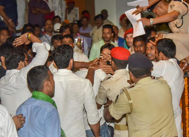 Police detains a youth who threw a slipper at Bihar chief minister Nitish Kumar during 'Virat Chhatra Sanagam' in Patna on Thursday. (PTI) Police detains a youth who threw a slipper at Bihar chief minister Nitish Kumar during 'Virat Chhatra Sanagam' in Patna on Thursday. (PTI)