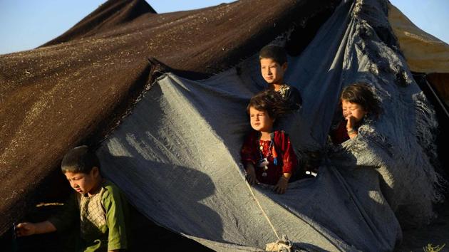 “Everyone is starving here,” Naw Khan Zamanzai said sitting in his tent surrounded by his six children. “We didn’t care about the war as it’s been going on for years. We were happy, busy farming but because of the drought our children were starving.” The rising numbers have overwhelmed Afghan officials and foreign aid groups, who are struggling to meet demand for food, shelter and health services as winter approaches. (Hoshang Hashimi / AFP) “Everyone is starving here,” Naw Khan Zamanzai said sitting in his tent surrounded by his six children. “We didn’t care about the war as it’s been going on for years. We were happy, busy farming but because of the drought our children were starving.” The rising numbers have overwhelmed Afghan officials and foreign aid groups, who are struggling to meet demand for food, shelter and health services as winter approaches. (Hoshang Hashimi / AFP)