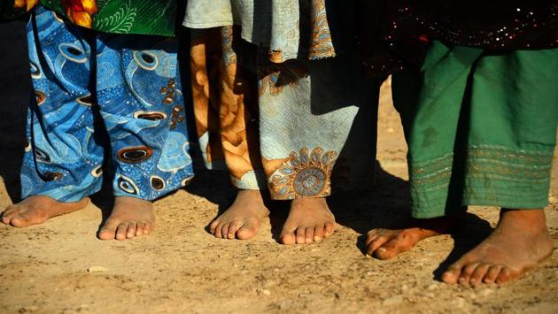 Dust whipped up by the relentless wind has become a second skin for camp dwellers.The children have little to play with except rocks -- when they are not filling their family’s jugs with water delivered by trucks, begging or collecting rubbish in the city. (Hoshang Hashimi / AFP) Dust whipped up by the relentless wind has become a second skin for camp dwellers.The children have little to play with except rocks -- when they are not filling their family’s jugs with water delivered by trucks, begging or collecting rubbish in the city. (Hoshang Hashimi / AFP)