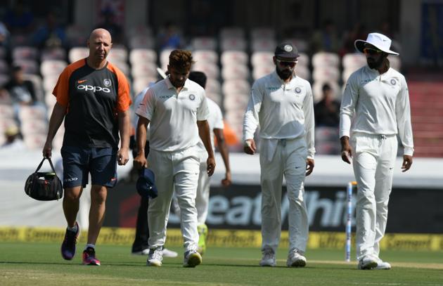 Indian cricketer Shardul Thakur (2nd-L) walks back with physio during the first day's play of the second Test cricket match between India and West Indies at the Rajiv Gandhi International Cricket Stadium in Hyderabad (AFP) Indian cricketer Shardul Thakur (2nd-L) walks back with physio during the first day's play of the second Test cricket match between India and West Indies at the Rajiv Gandhi International Cricket Stadium in Hyderabad (AFP)